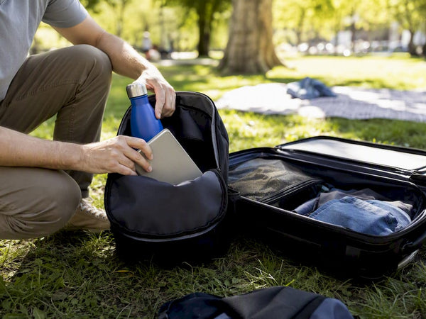 Traveler packing personal and carry-on bags